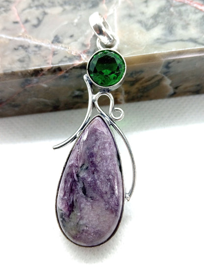 Purple charoite pendant with faceted olivine