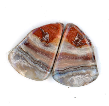 A pair of crazy lace agate cabochons