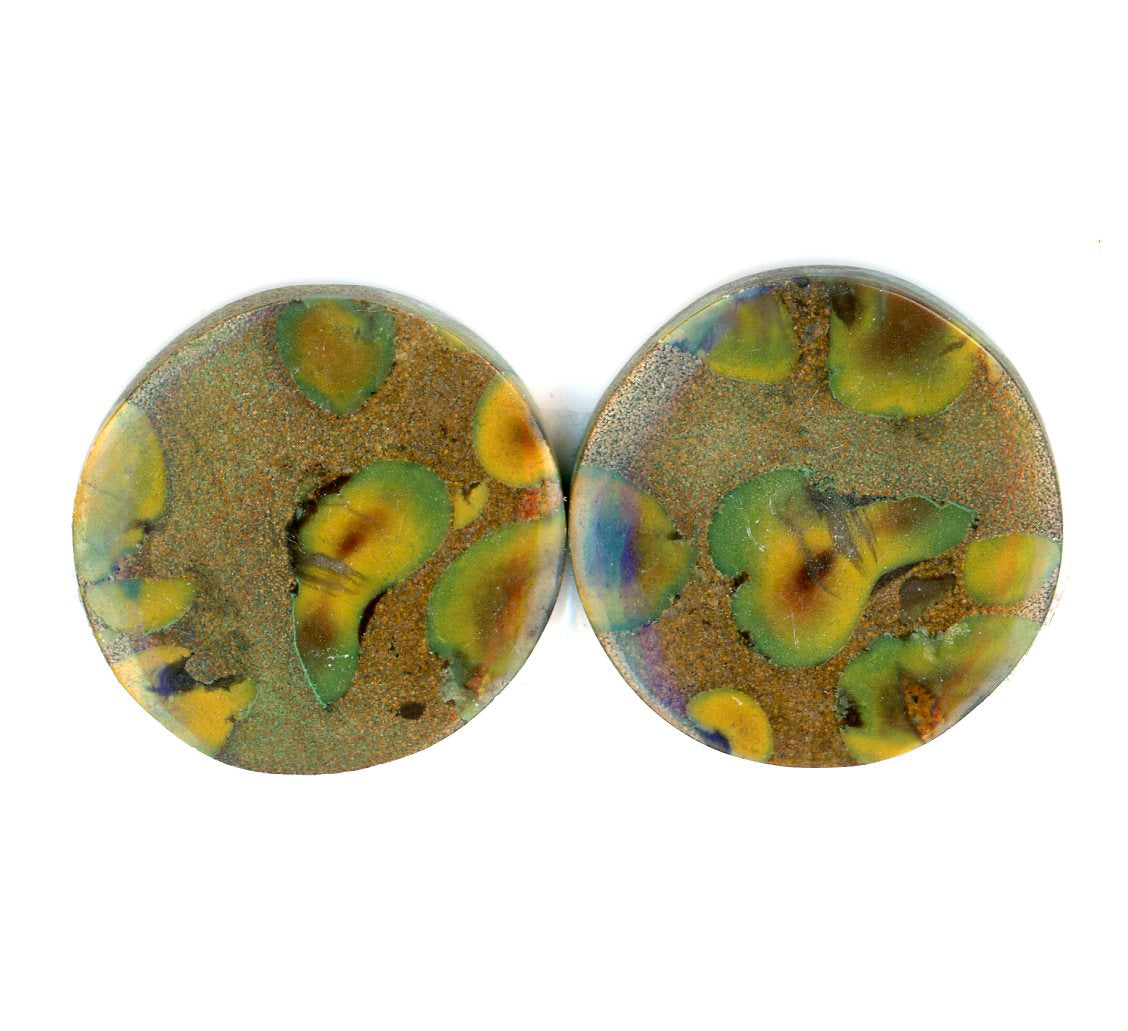 A pair of fruit jasper cabochons