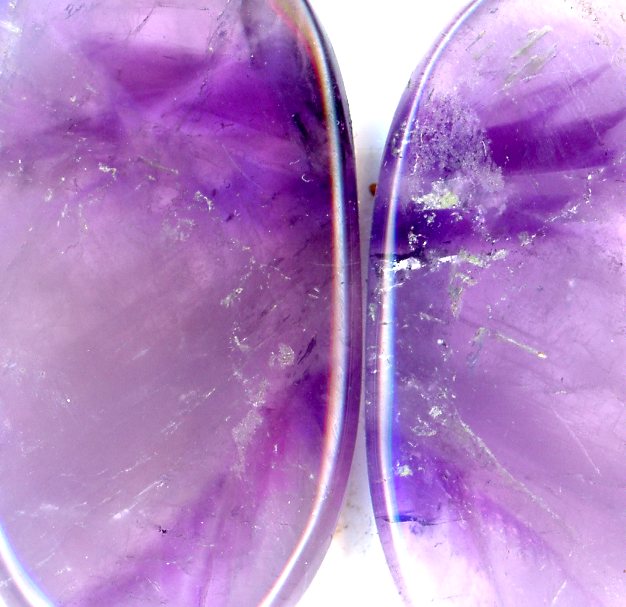 A pair of amethyst cabochons