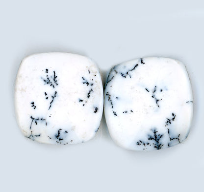 A pair of dendritic opal cabochons