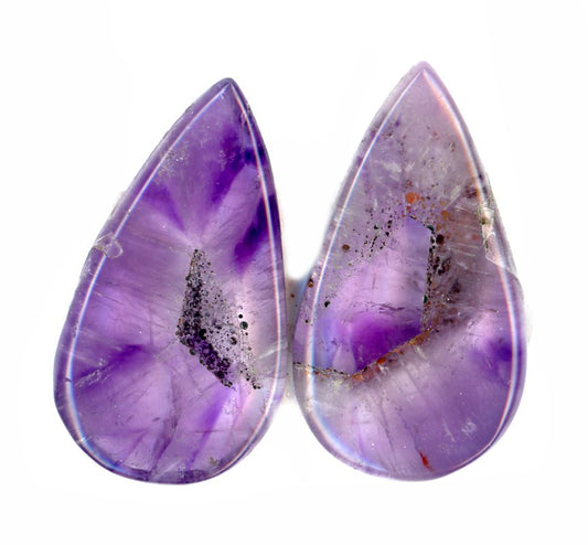 A pair of amethyst cabochons