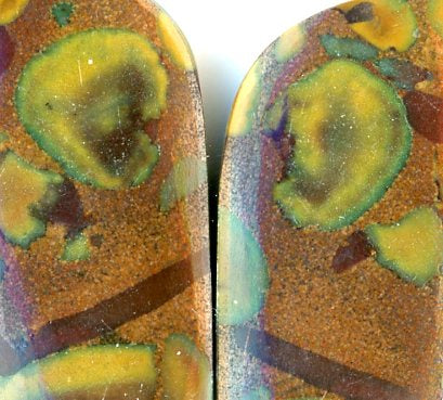 A pair of fruit jasper cabochons