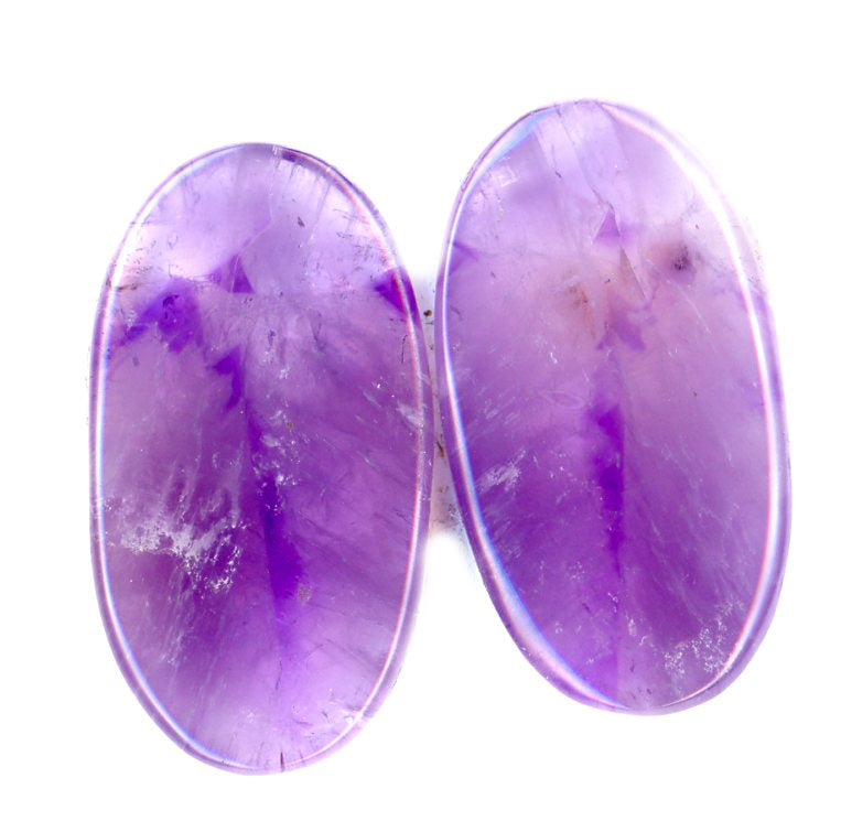 A pair of amethyst cabochons