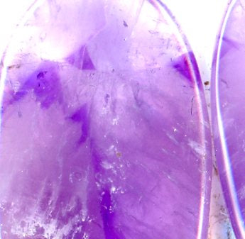 A pair of amethyst cabochons