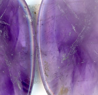 A pair of amethyst cabochons
