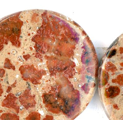 A pair of asteroid jasper cabochons
