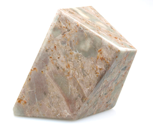 Paperweight of pink limestone with fossils