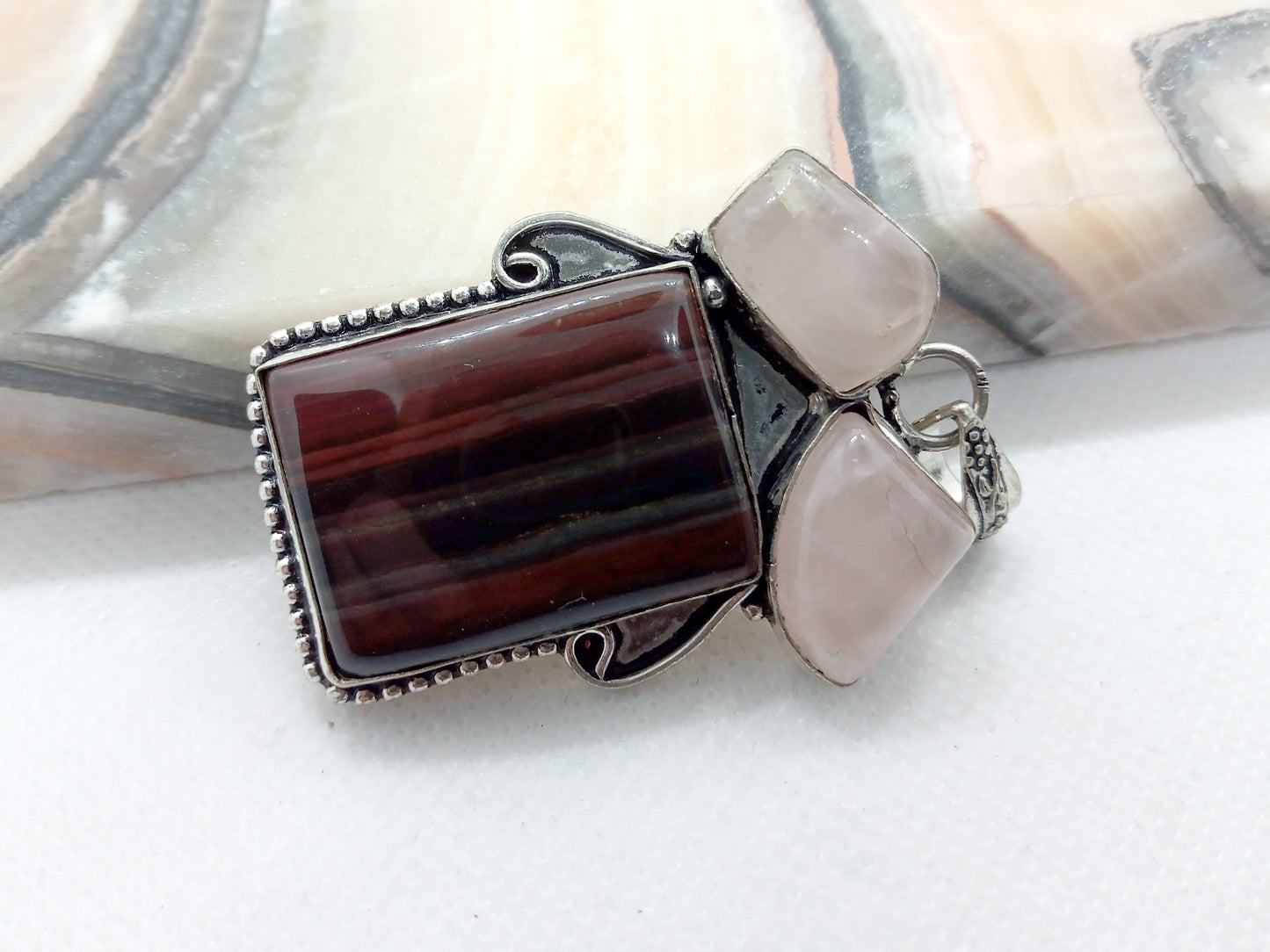 Banded iron ore and rose gold pendant