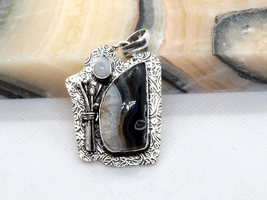 Onyx pendant with crystal and moonstone